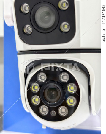 Close-up of modern dual lens CCTV security camera Close-up of modern dual lens CCTV security camera 142324643