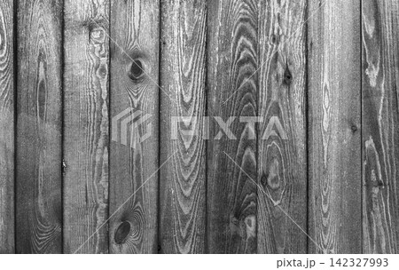 Close-up monochrome photography of weathered wooden fence planks Close-up monochrome photography of weathered wooden fence planks 142327993