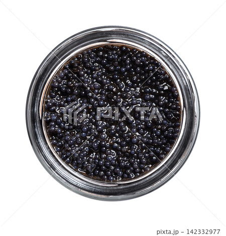 Black caviar made from lumpfish roe, in a glass jar, isolated from above. Affordable, small, deep black dyed, salted fish eggs, from Cyclopterus lumpus, also called lumpsucker, used as garnish. Photo Black caviar made from lumpfish roe, in a glass jar, isolated from above. Affordable, small, deep black dyed, salted fish eggs, from Cyclopterus lumpus, also called lumpsucker, used as garnish. Photo 142332977