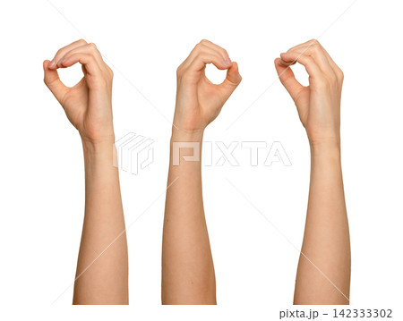 Female hand forming circle with thumb and index finger, arm raised. OK sign gesture encircling Female hand forming circle with thumb and index finger, arm raised. OK sign gesture encircling 142333302