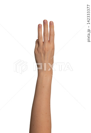 Female left hand raises three fingers upward in a row. Gesture suggests counting or showing the Female left hand raises three fingers upward in a row. Gesture suggests counting or showing the 142333377