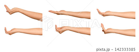 Female palm curves upward cradling an unseen item, side view. Fingers gently close around something Female palm curves upward cradling an unseen item, side view. Fingers gently close around something 142333385