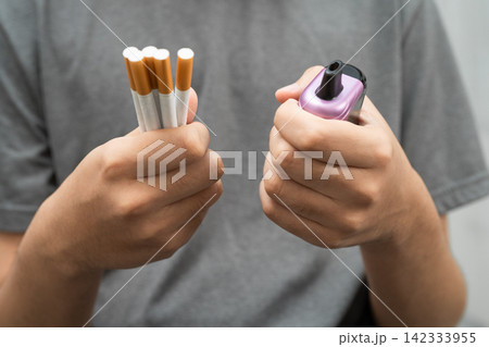 Man holding electronic cigarettes, no smoking. Man holding electronic cigarettes, no smoking. 142333955