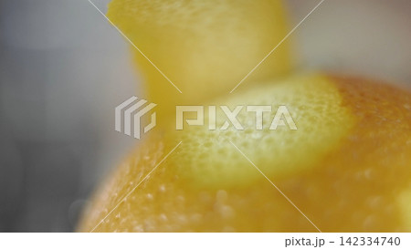 Citrus zest texture macro detail. Peeling orange skin, fresh fruit ingredient for cooking and baking Citrus zest texture macro detail. Peeling orange skin, fresh fruit ingredient for cooking and baking 142334740
