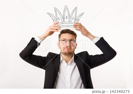 Man Holding a Crown Above His Head Pride, Arrogance and Inflated Ego Man Holding a Crown Above His Head Pride, Arrogance and Inflated Ego 142340273