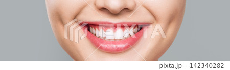 Close-Up of a Young Woman's Beautiful Smile 142340282