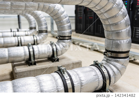 Industrial insulated pipes with metal clamps in a data center environment Industrial insulated pipes with metal clamps in a data center environment 142341482