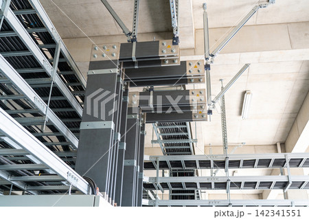 Industrial electrical busbar system with cable trays and conduits overhead 142341551