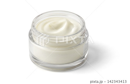 Open glass jar of white cream on white background with soft top swirl and glossy reflections 142343413