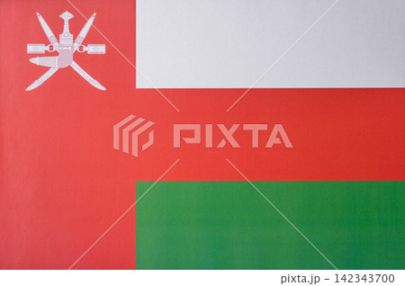 Oman, the Omani flag as a symbol of national independence. The Omani flag Oman, the Omani flag as a symbol of national independence. The Omani flag 142343700