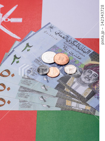 Oman, omani paper money, rial or riyal banknotes and coins as currency for exchange. Omani money Oman, omani paper money, rial or riyal banknotes and coins as currency for exchange. Omani money 142343728