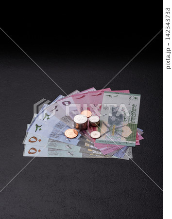 Oman, omani paper money, rial or riyal banknotes and coins as currency for exchange. Omani money Oman, omani paper money, rial or riyal banknotes and coins as currency for exchange. Omani money 142343738
