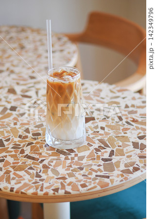 Coffee drink on a table in a cafe setting Coffee drink on a table in a cafe setting 142349796