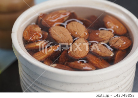Soaking almonds in water for cooking process Soaking almonds in water for cooking process 142349858