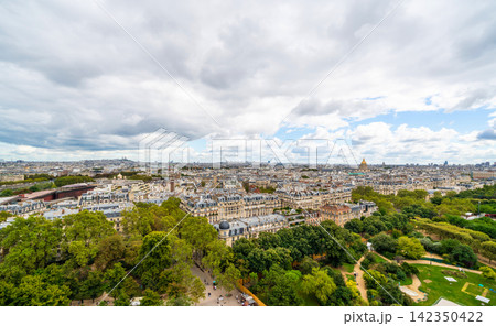Panoramic aerial view of paris cityscape with green park under cloudy sky in france Panoramic aerial view of paris cityscape with green park under cloudy sky in france 142350422