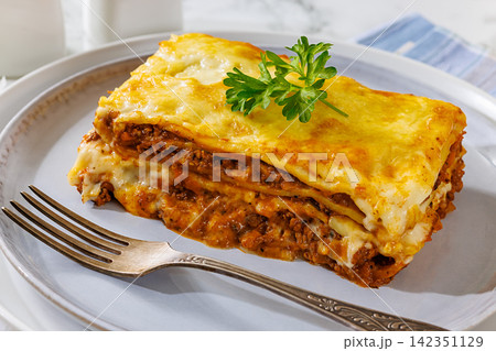 Lasagne alla Bolognese with beef ragu, cheese Lasagne alla Bolognese with beef ragu, cheese 142351129