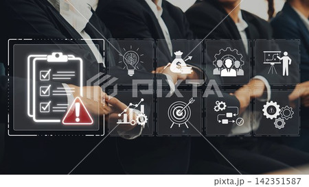 A group of business professionals engaged in a meeting with emphasis on project management, featuring checklists and strategic icons that symbolize effective collaboration and planning. Sigmoid 142351587