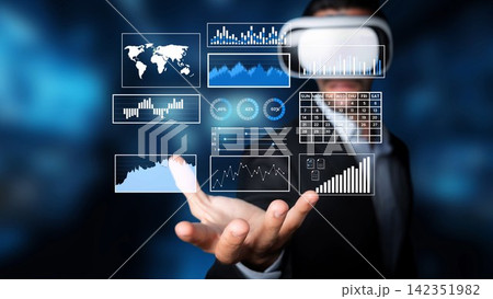 Business professional utilizing virtual reality technology to analyze data with interactive graphs and charts in a modern digital workspace environment Gluon Business professional utilizing virtual reality technology to analyze data with interactive graphs and charts in a modern digital workspace environment Gluon 142351982