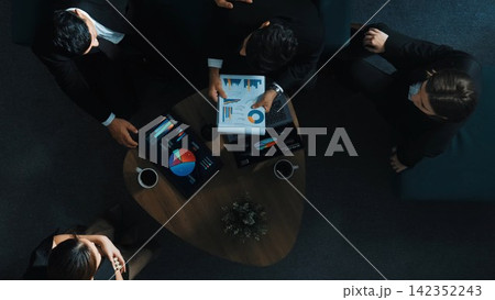 Top down view of business team analyze data while point at chart. Directorate. Top down view of business team analyze data while point at chart. Directorate. 142352243