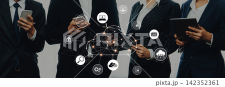 Business Professionals Engaging with Technology and Digital Connectivity in a Modern Workspace Featuring Cloud Computing and Networking Icons Trope Business Professionals Engaging with Technology and Digital Connectivity in a Modern Workspace Featuring Cloud Computing and Networking Icons Trope 142352361
