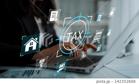 Business professional working on a laptop with digital tax icons overlayed on the screen, representing modern financial management and taxation processes. Gluon Business professional working on a laptop with digital tax icons overlayed on the screen, representing modern financial management and taxation processes. Gluon 142352608