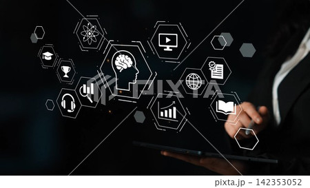 Business Professional Interacting with Digital Icons Representing Innovation, Technology, and Learning in Modern Work Environment Gluon 142353052
