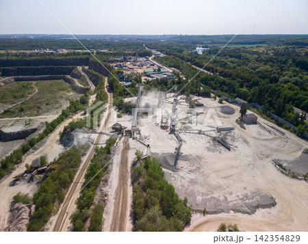 Panoramic high angle drone view of active stone processing plant and crushing facility Panoramic high angle drone view of active stone processing plant and crushing facility 142354829