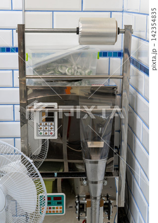 Automatic Form Fill Seal Packaging Machine in Commercial Kitchen 142354835