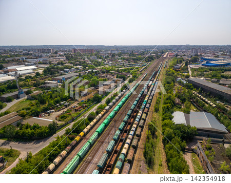 Panoramic aerial view of large industrial railway junction with multiple cargo trains 142354918