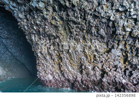 Basalt rock cave formation in Vestmannaeyjar, Iceland Basalt rock cave formation in Vestmannaeyjar, Iceland 142356898