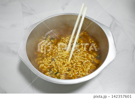 Hot Instant Ramen Noodles with Chopsticks 142357601