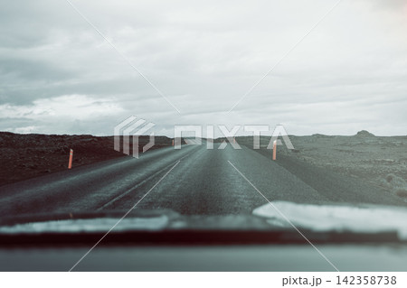 Volcanic road through a car window with nostalgic cyan-red film color, Reykjanes, Iceland Volcanic road through a car window with nostalgic cyan-red film color, Reykjanes, Iceland 142358738