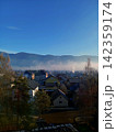 village in the winter 142359174