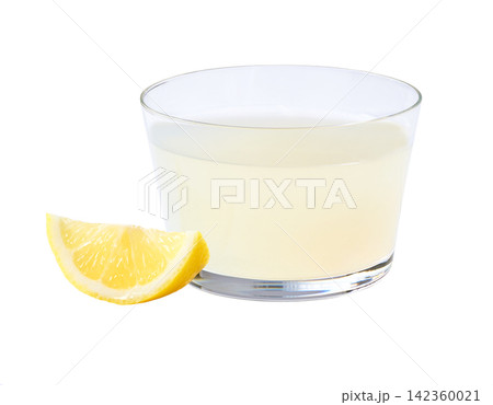 Glass of freshly squeezed lemon juice isolated on white background. glass of lemon juice drink isolated . Glass of freshly squeezed lemon juice isolated on white background. glass of lemon juice drink isolated . 142360021