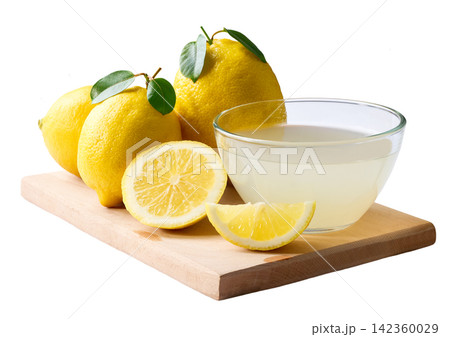 Fresh lemons fruit and bowl of lemon juice isolated on white background. freshly squeezed lemon juice. 142360029