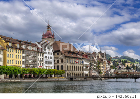Embankment of Reuss river with historic buildings and colorful facades in Lucerne, Switzerland. Cloudy June sky in summer 142360211