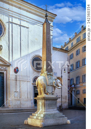Elephant and Obelisk by Bernini in Rome, Italy, with Church facade. Santa Maria sopra Minerva, Gothic architecture, daylight 142360354