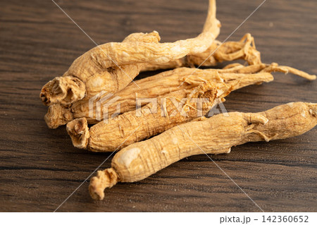 Ginseng roots and green leaf, organic nature healthy food. Ginseng roots and green leaf, organic nature healthy food. 142360652
