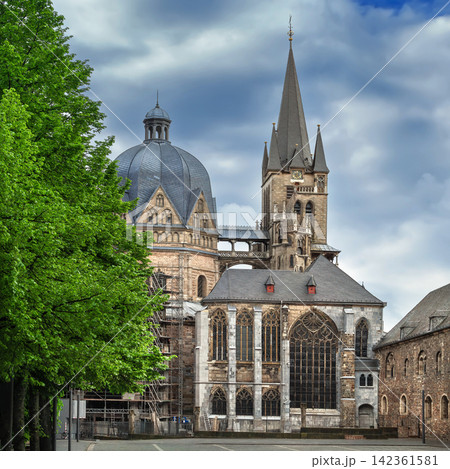 Aachen Cathedral facade view from the city hall courtyard in Aachen Germany. Square crop of gothic architecture style Aachen Cathedral facade view from the city hall courtyard in Aachen Germany. Square crop of gothic architecture style 142361581