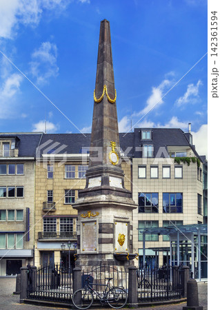 Obelisk on the market square at Old City Hall of Bonn Germany. Close up view of historic baroque monument architecture Obelisk on the market square at Old City Hall of Bonn Germany. Close up view of historic baroque monument architecture 142361594