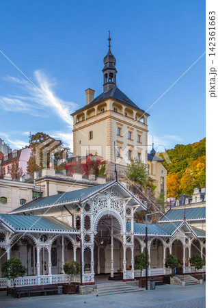Market Colonnade and Castle Tower in Karlovy Vary, Czech Republic. Historical architecture under clear blue sunny sky in Bohemia Market Colonnade and Castle Tower in Karlovy Vary, Czech Republic. Historical architecture under clear blue sunny sky in Bohemia 142361663