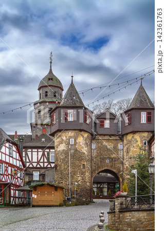 Historic city gate tower in Braunfels old town, Germany. Ancient stone archway with church tower under cloudy sky, no people 142361763