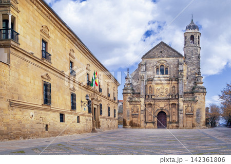 View of Holy Chapel of the Saviour and Dean Ortega Palace in Ubeda, Spain. Renaissance architecture under cloudy sky at daytime View of Holy Chapel of the Saviour and Dean Ortega Palace in Ubeda, Spain. Renaissance architecture under cloudy sky at daytime 142361806