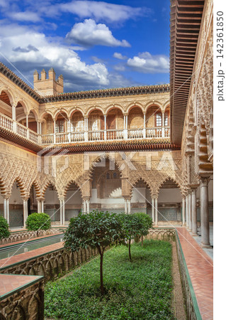 Main courtyard Patio de las Doncellas in Alcazar of Seville Spain. Mudejar architecture with arches and stone columns Main courtyard Patio de las Doncellas in Alcazar of Seville Spain. Mudejar architecture with arches and stone columns 142361850