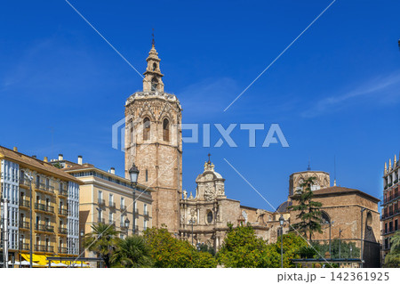 View of Valencia Cathedral from Plaza de la Reina, Spain, wide angle. Historic baroque facade and bell tower under sunny sky View of Valencia Cathedral from Plaza de la Reina, Spain, wide angle. Historic baroque facade and bell tower under sunny sky 142361925
