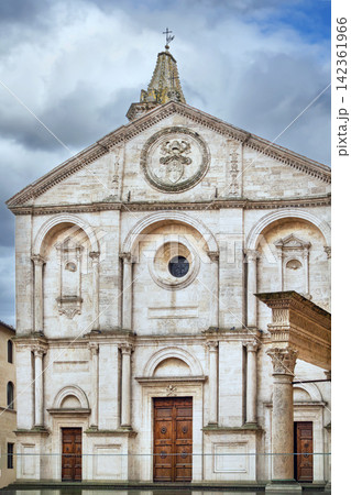 Duomo of Pienza Cathedral in Italy front facade view. Renaissance architecture under overcast cloudy sky Duomo of Pienza Cathedral in Italy front facade view. Renaissance architecture under overcast cloudy sky 142361966