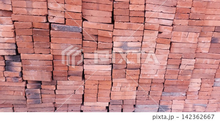 A stack of red bricks for construction. 142362667
