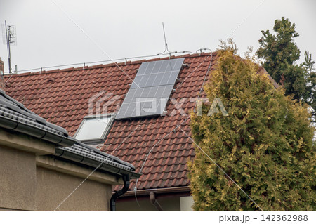Solar Panels Installed on Red Tiled Residential Roof 142362988