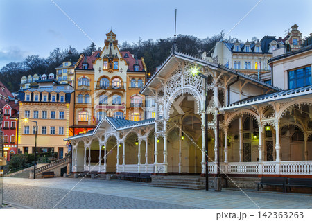 Market Colonnade in the city center of Karlovy Vary, Czech Republic. Scenic view at sunset. Warm evening light with blue sky Market Colonnade in the city center of Karlovy Vary, Czech Republic. Scenic view at sunset. Warm evening light with blue sky 142363263