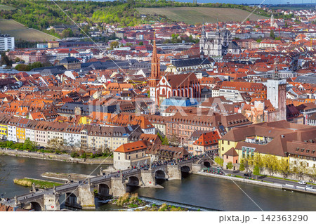 Elevated close up view of Wurzburg historical center with Old Main Bridge Germany. Scenic old town cityscape under cloudy sky 142363290